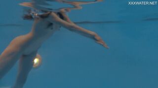 Petite Russian Marfa swims nude in the pool